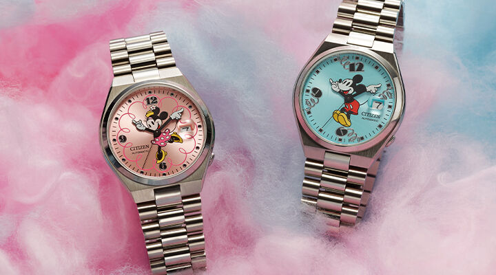 Disney watches featuring TSUYOSA Minnie Mouse and TSUYOSA Mickey Mouse watch models NJ0150-50W and NJ0156-50L sitting on cotton candy background