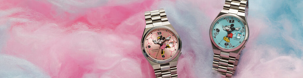 Disney watches featuring TSUYOSA Minnie Mouse and TSUYOSA Mickey Mouse watch models NJ0150-50W and NJ0156-50L sitting on cotton candy background