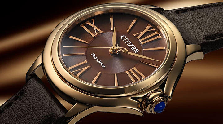 Women's Citizen L Ceci watches; Featuring Citizen L Ceci watch model EM1163-09X on a chocolate background